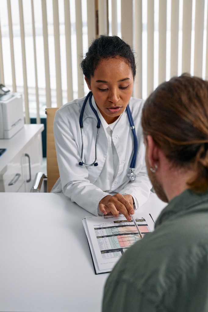 Clinician reviewing documented evidence with a patient.